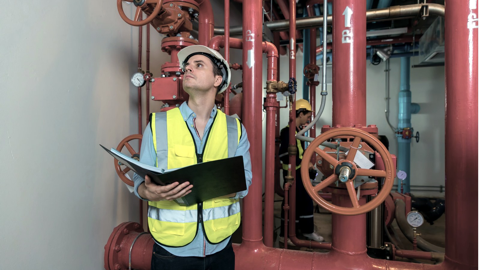 A technician inspecting a commercial fire suppression system